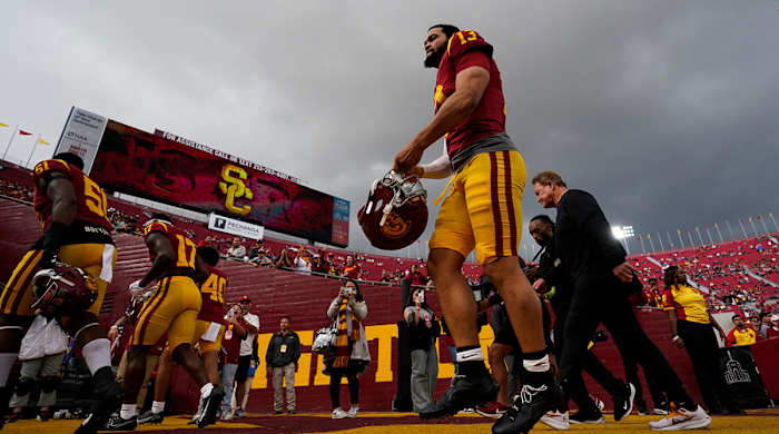 USC quarterback Caleb Williams (13) makes his way off the field after warmup up before a game against UCLA.